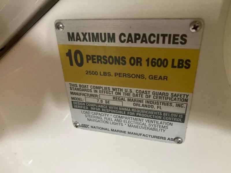 Slide: The Image of 1996 Regal 7.0 SE capacity plate, maximum 10 persons or 1600 lbs, U.S. Coast Guard compliant. - 13