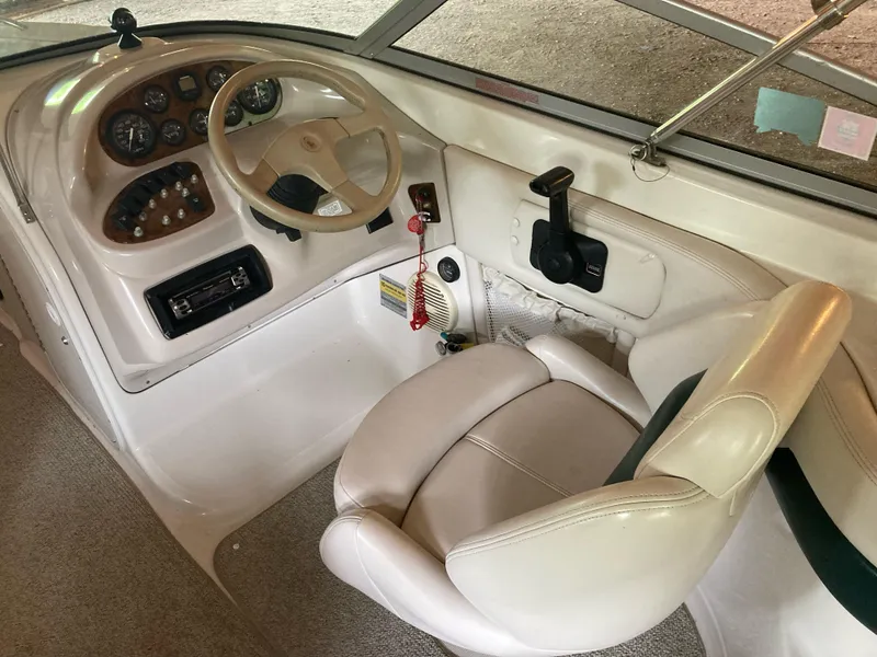 Slide: The Image of 1996 Regal 7.0 SE boat cockpit with steering wheel and control panel. - 5