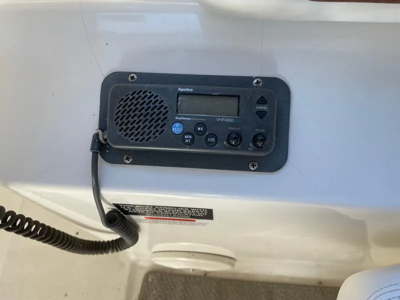 Slide: The Image of VHF radio on 1999 Wellcraft 3600 Martinique boat dashboard. - 16