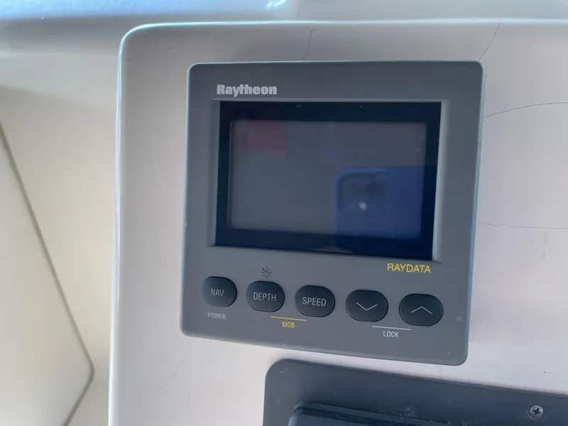 Slide: The Image of Raytheon Raydata display on 1999 Wellcraft 3600 Martinique boat dashboard. - 18