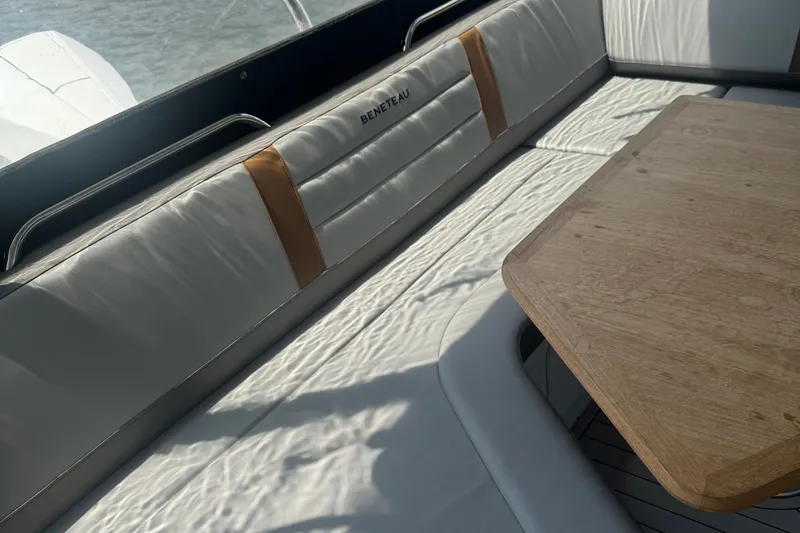 Slide: The Image of Luxurious seating and table on 2023 Beneteau Gran Turismo 32 yacht. - 12