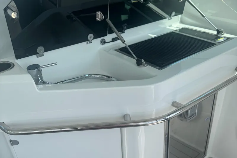 Slide: The Image of 2023 Beneteau Gran Turismo 32 yacht kitchen area with sink and grill. - 16