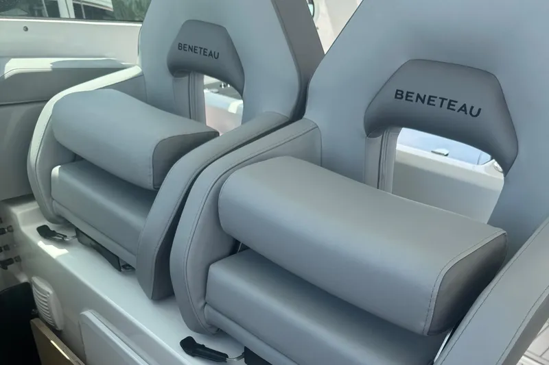 Slide: The Image of Luxury seating on 2023 Beneteau Gran Turismo 32 boat, featuring plush gray upholstery. - 17
