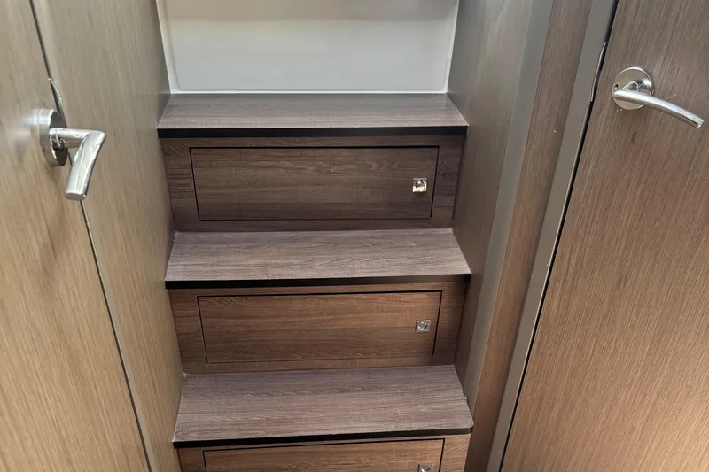Slide: The Image of Interior stairs with storage on 2023 Beneteau Gran Turismo 32 yacht. - 21