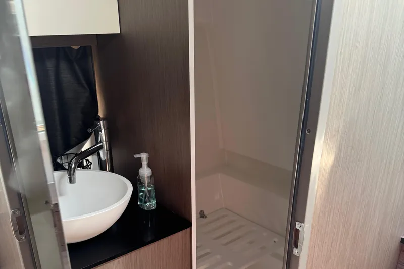 Slide: The Image of Modern bathroom interior on 2023 Beneteau Gran Turismo 32 yacht, featuring sink and shower. - 26