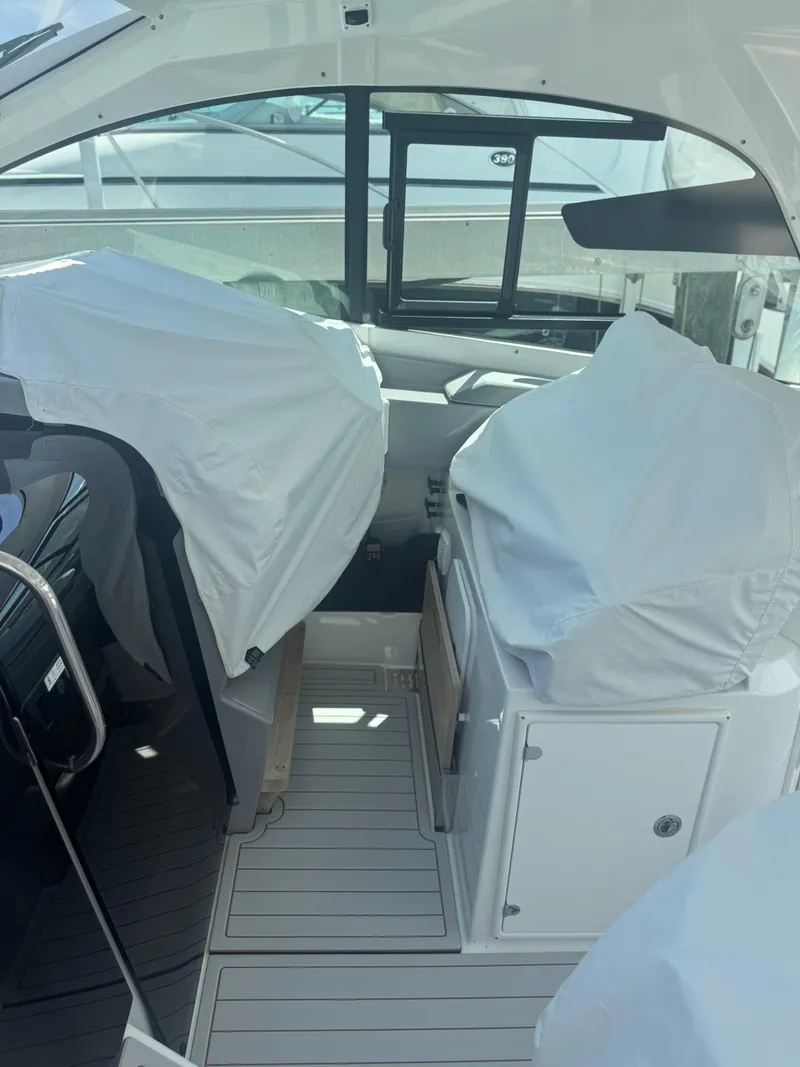 Slide: The Image of Interior view of 2023 Beneteau Gran Turismo 32 yacht, featuring covered seating and modern design. - 3