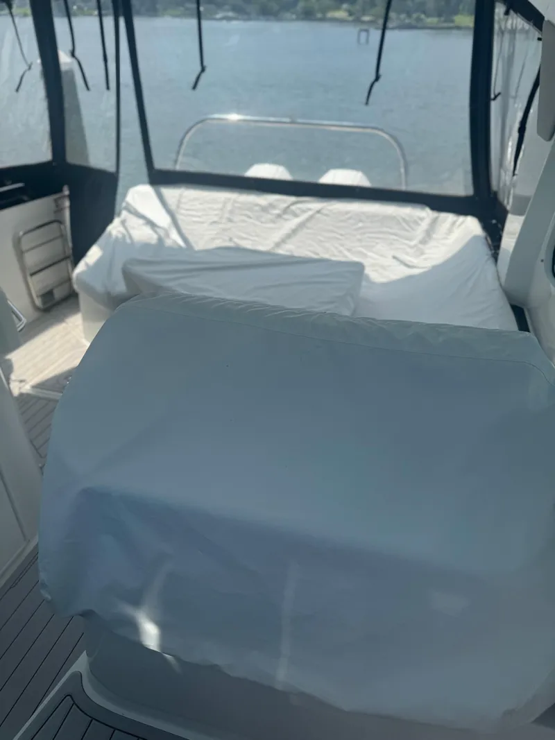 Slide: The Image of Interior view of 2023 Beneteau Gran Turismo 32 yacht with covered seating area. - 4