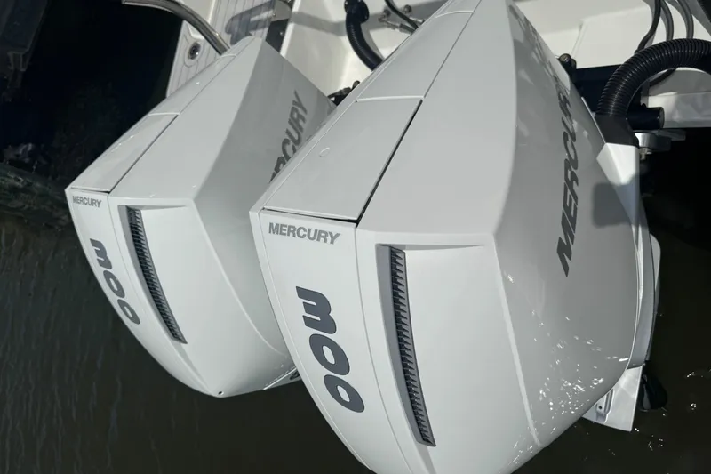 Slide: The Image of Twin Mercury outboard engines on a 2023 Beneteau Gran Turismo 32 boat. - 6