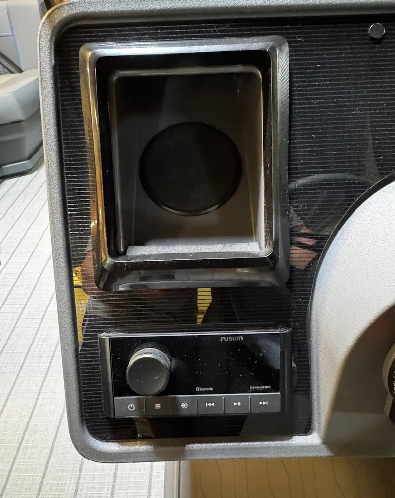 Slide: The Image of 2025 Manitou Explore audio system with Bluetooth and speaker integration. - 6