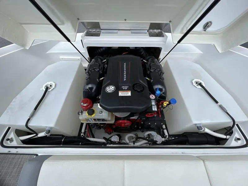 Slide: The Image of Engine compartment of a 2018 Cobalt CS23 Surf boat, featuring a Volvo Penta engine. - 12