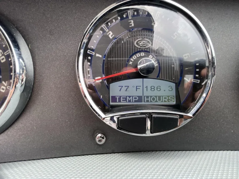 Slide: The Image of Close-up of 2018 Cobalt CS23 Surf dashboard gauge showing temperature and engine hours. - 13
