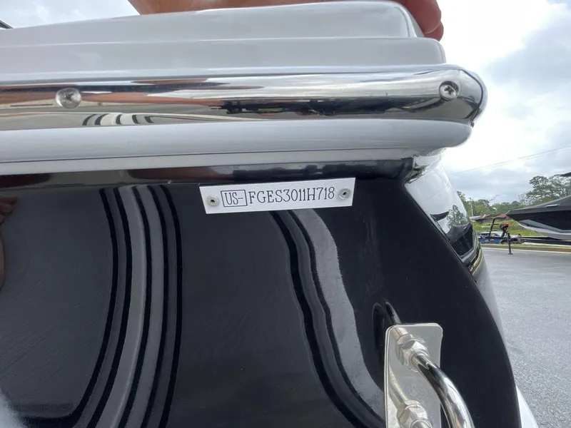 Slide: The Image of 2018 Cobalt CS23 Surf boat with visible hull identification number. - 19