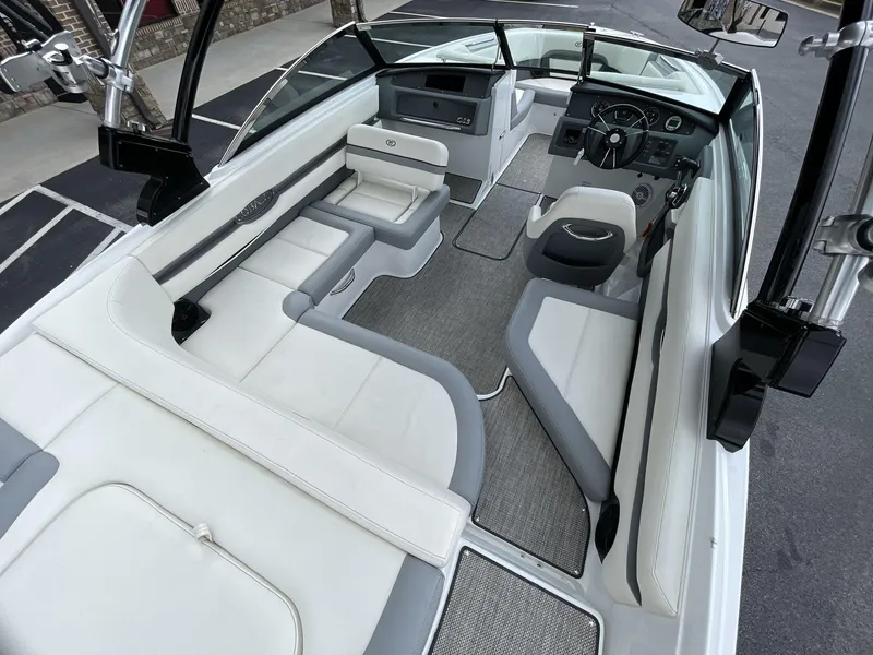 Slide: The Image of 2018 Cobalt CS23 Surf boat interior with sleek seating and modern dashboard design. - 20