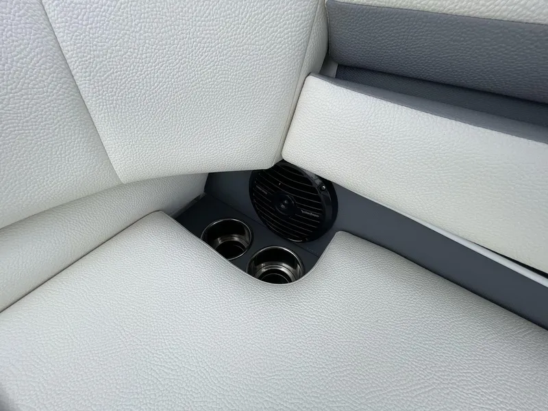 Slide: The Image of 2018 Cobalt CS23 Surf interior with white leather seats and built-in cup holders. - 21