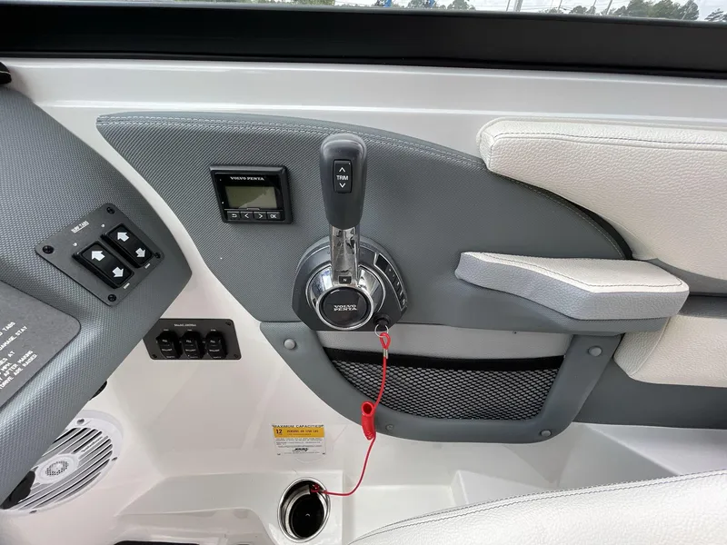 Slide: The Image of Control panel of a 2018 Cobalt CS23 Surf boat with Volvo Penta throttle. - 24