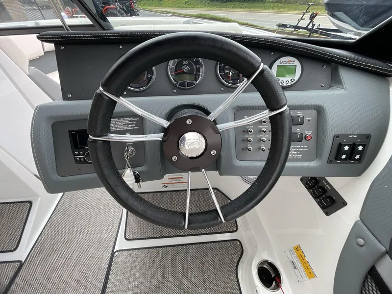 Slide: The Image of Steering wheel and dashboard of 2018 Cobalt CS23 Surf boat. - 25
