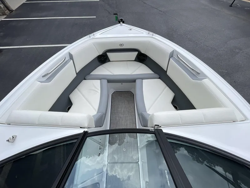 Slide: The Image of 2018 Cobalt CS23 Surf boat interior with white seating and gray accents. - 27