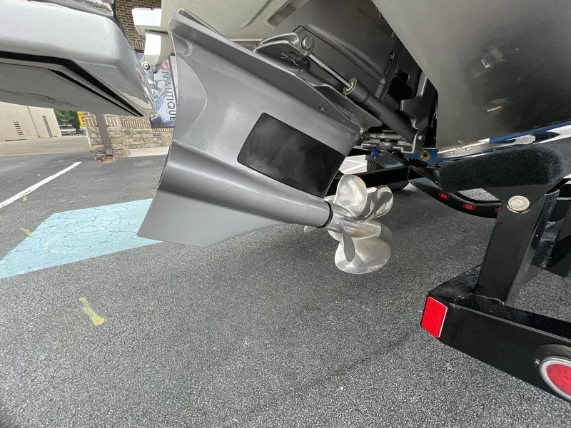 Slide: The Image of 2018 Cobalt CS23 Surf boat propeller and outdrive on a trailer. - 6