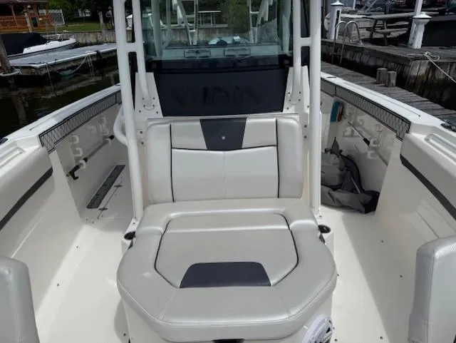 Slide: The Image of 2018 Wellcraft 302 Fisherman boat interior with seating and storage compartments. - 15