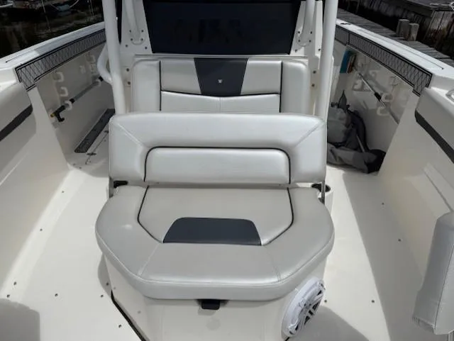 Slide: The Image of 2018 Wellcraft 302 Fisherman boat interior with cushioned seating and sleek design. - 16