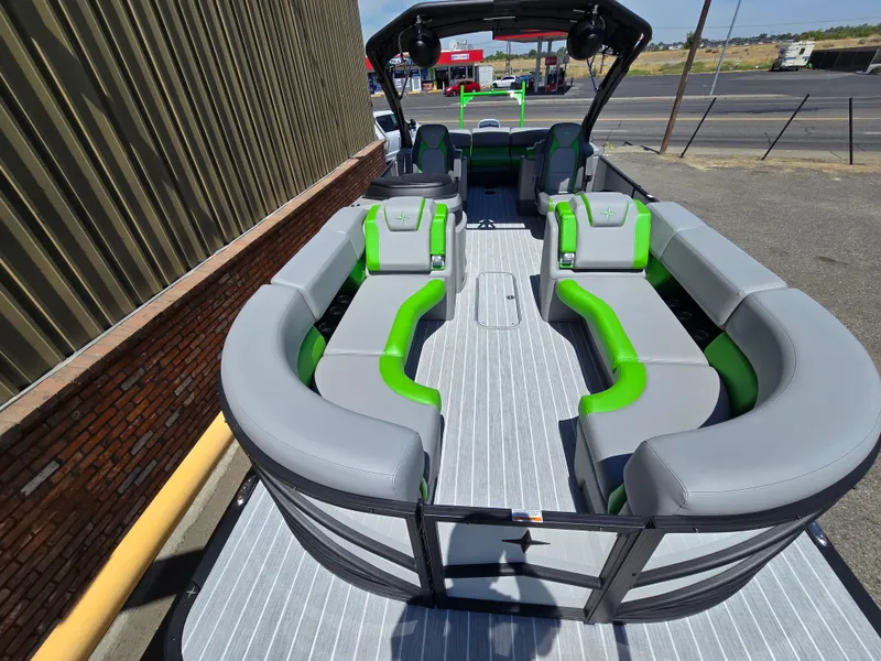 Slide: The Image of 2026 Berkshire STS 25 RFX 3.0+ pontoon boat with sleek gray and green seating. - 10