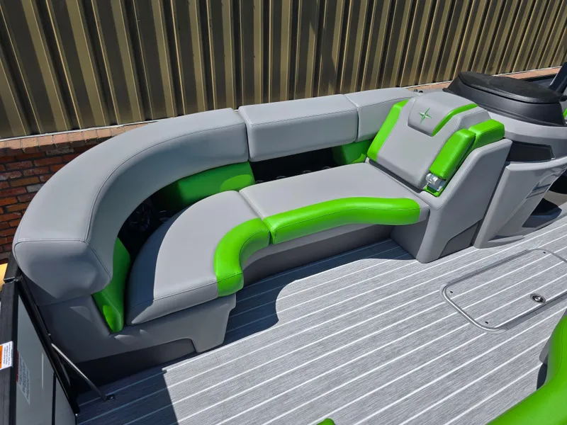 Slide: The Image of 2026 Berkshire STS 25 RFX 3.0+ boat interior with gray and green seating. - 11