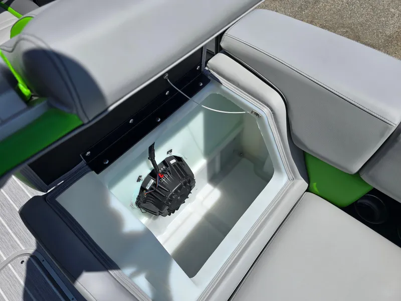 Slide: The Image of 2026 Berkshire STS 25 RFX 3.0+ boat storage compartment with sleek gray seating. - 15