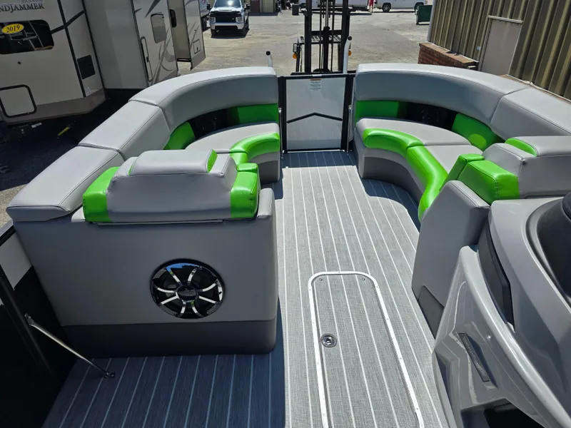 Slide: The Image of 2026 Berkshire STS 25 RFX 3.0+ pontoon boat interior with gray and green seating. - 18