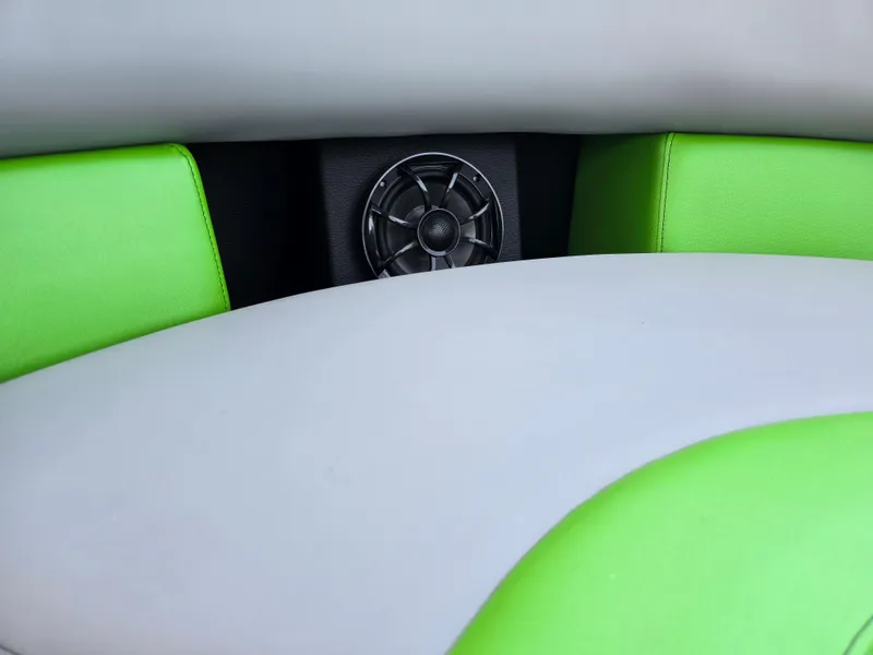 Slide: The Image of 2026 Berkshire STS 25 RFX 3.0+ boat interior with green and gray seating. - 27