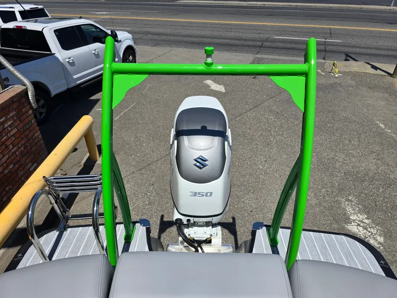 Slide: The Image of 2026 Berkshire STS 25 RFX 3.0+ with Suzuki 350 engine, green frame, parked on pavement. - 32