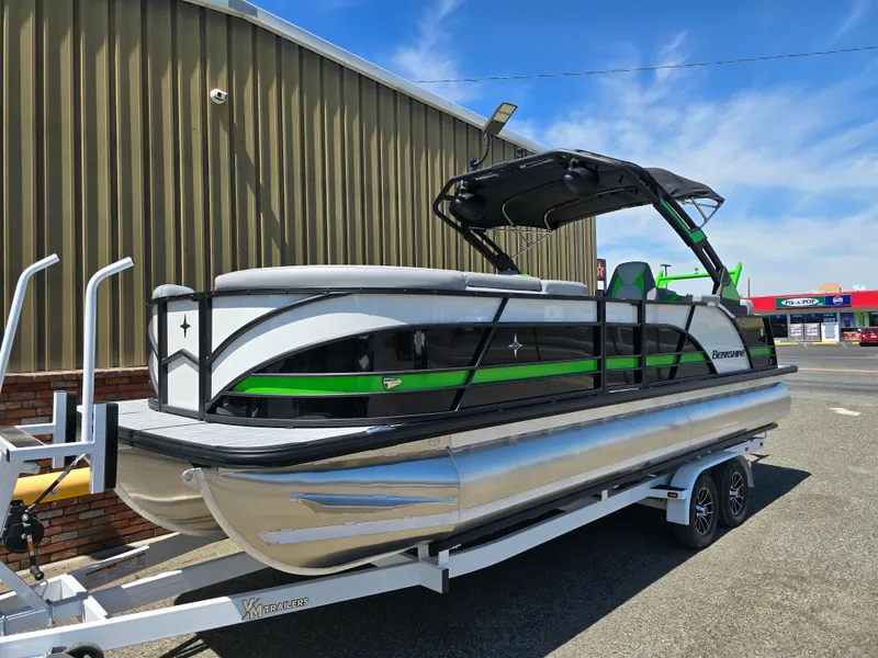 Slide: The Image of 2026 Berkshire STS 25 RFX 3.0+ pontoon boat on trailer, parked outdoors. - 5