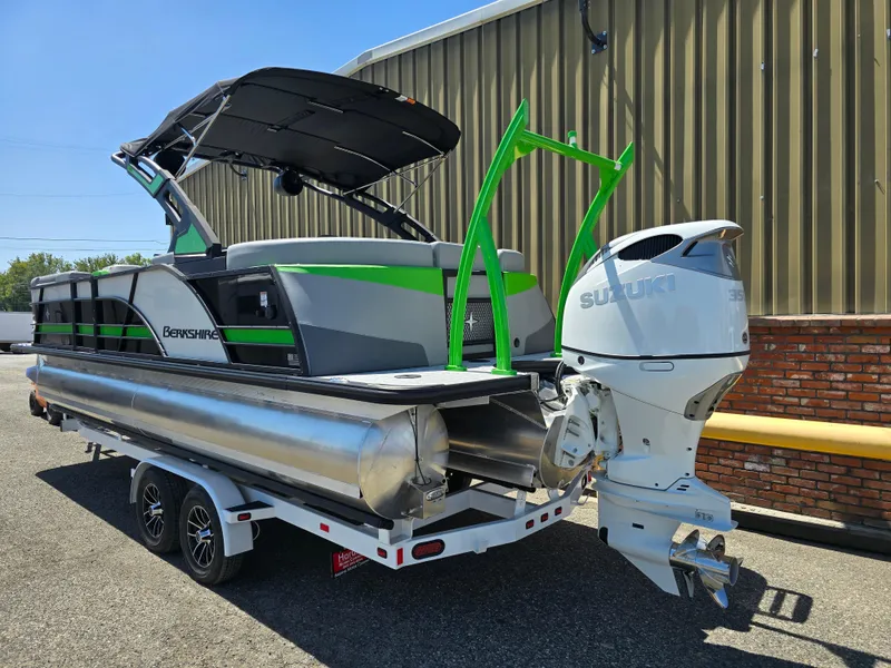 Slide: The Image of 2026 Berkshire STS 25 RFX 3.0+ pontoon boat with Suzuki outboard motor on trailer. - 6