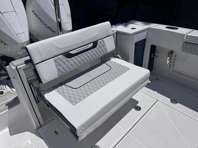 Slide: The Image of 2026 Blackfin 272 DC boat with luxurious seating and Mercury engines. - 11