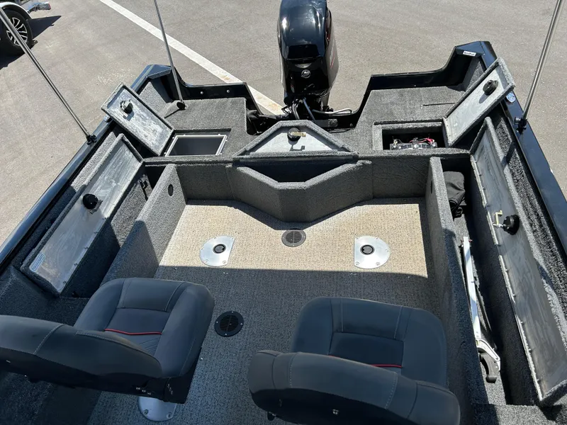 Slide: The Image of 2022 Tracker Pro Guide V-16 SC boat interior with seating and storage compartments. - 14