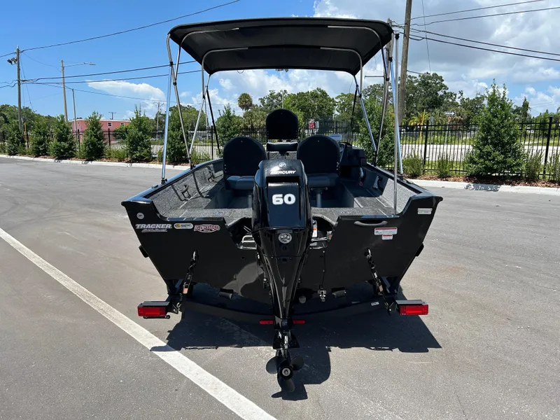 Slide: The Image of 2022 Tracker Pro Guide V-16 SC boat with Mercury 60 engine, parked outdoors. - 3