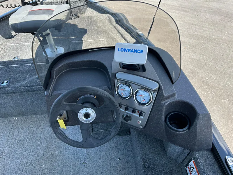 Slide: The Image of 2022 Tracker Pro Guide V-16 SC boat dashboard with steering wheel and Lowrance display. - 9
