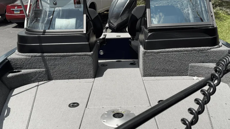 Slide: The Image of 2024 G3 Angler V178 F boat interior with carpeted deck and windshield. - 8