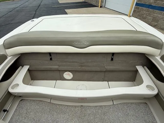 Slide: The Image of Rear seating area of a 2005 Sea Ray 200 Sport boat, featuring cushioned seats. - 16