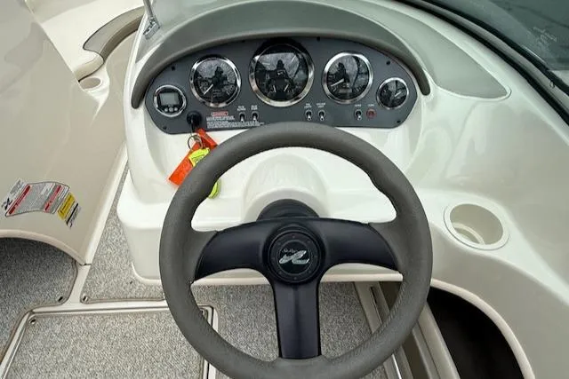 Slide: The Image of Steering wheel and dashboard of 2005 Sea Ray 200 Sport boat. - 4