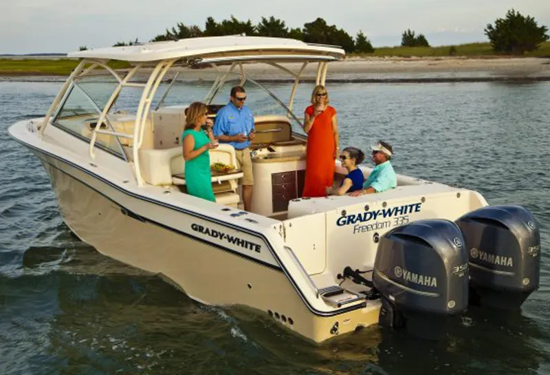 Slide: The Image of Manufacturer Provided Image: 2014 Grady-White Freedom 335 boat with Yamaha engines, people enjoying on water. - 2