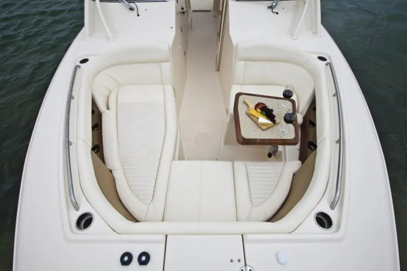 Slide: The Image of Manufacturer Provided Image: 2014 Grady-White Freedom 335 boat interior with seating and table. - 3