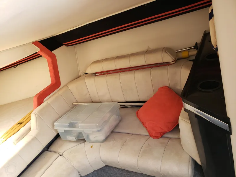 Slide: The Image of Interior of 1990 Fountain 27 Fever boat with seating, storage box, and cushion. - 6
