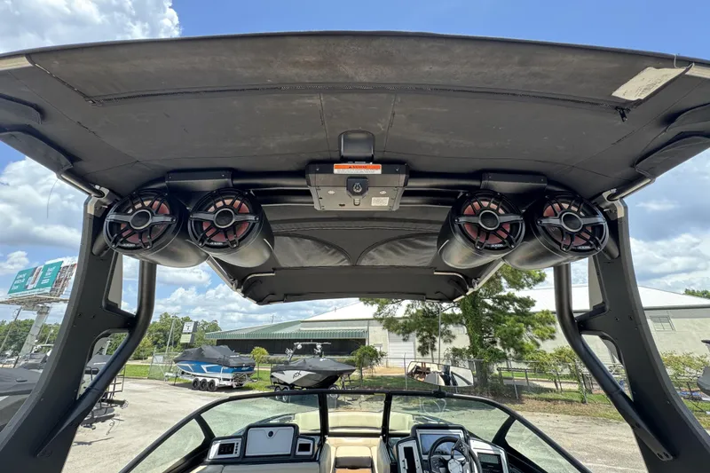 Slide: The Image of 2020 Supra SE 450 boat interior with speakers and control panel under canopy. - 14