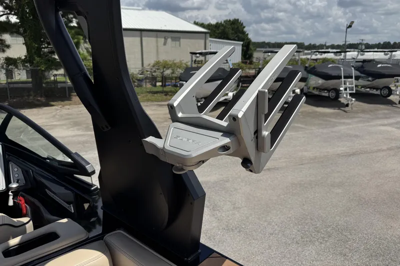 Slide: The Image of Boat tower rack on a 2020 Supra SE 450, parked in a marina. - 15