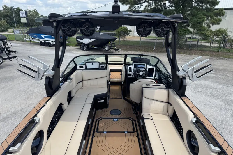 Slide: The Image of 2020 Supra SE 450 boat interior with beige seating and advanced audio system. - 6