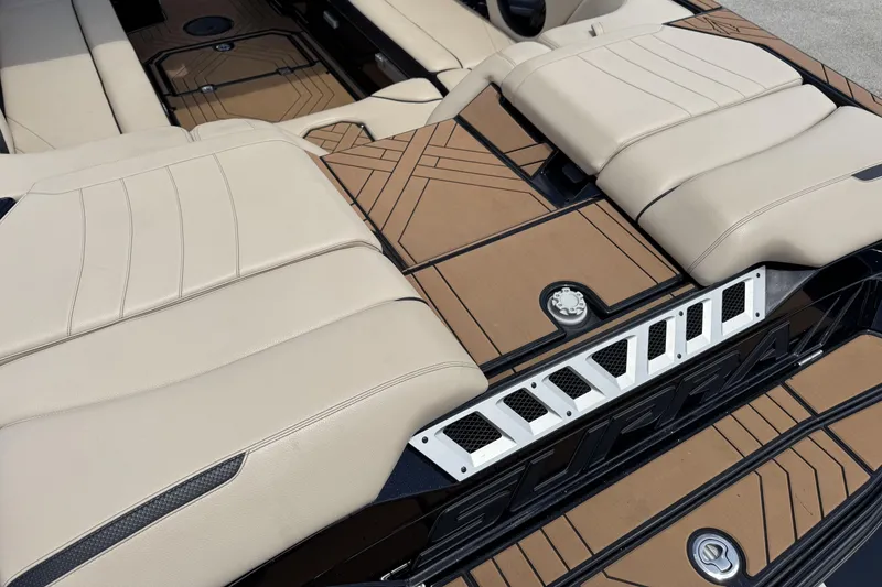 Slide: The Image of Luxurious interior of 2020 Supra SE 450 boat with beige seating and stylish flooring. - 7