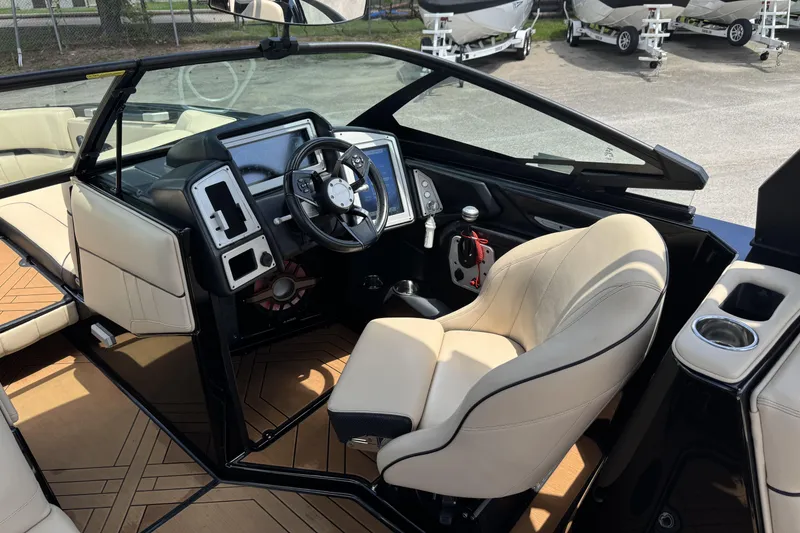 Slide: The Image of 2020 Supra SE 450 boat interior with modern dashboard and beige seating. - 8