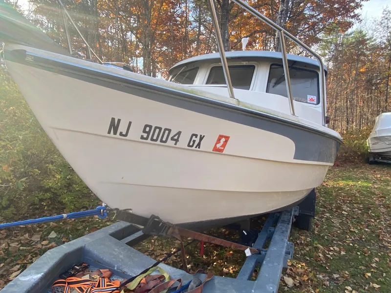 Slide: The Image of 2002 C-Dory 25' Cruiser on trailer, surrounded by autumn foliage. - 4