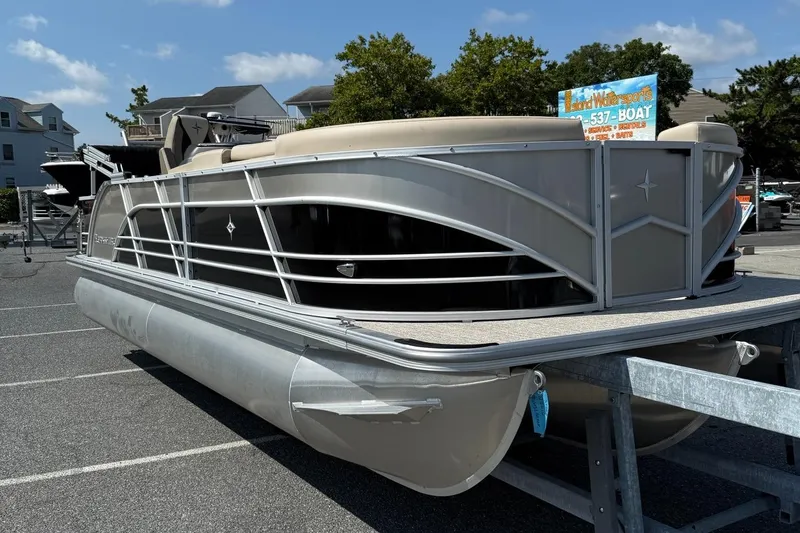 Slide: The Image of 2025 Berkshire 23CL STS 3.0 pontoon boat displayed in a parking lot. - 3