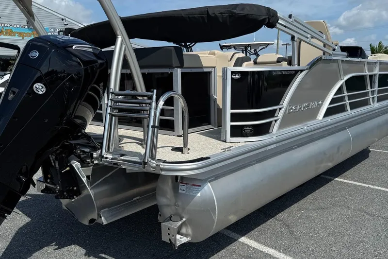 Slide: The Image of 2025 Berkshire 23CL STS 3.0 pontoon boat with sleek design and powerful outboard motor. - 8
